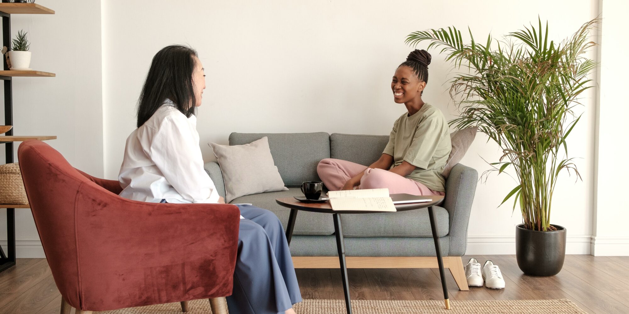 woman on couch talking to doctor